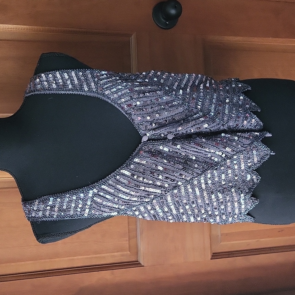 Grey vest with sequins and button down front.